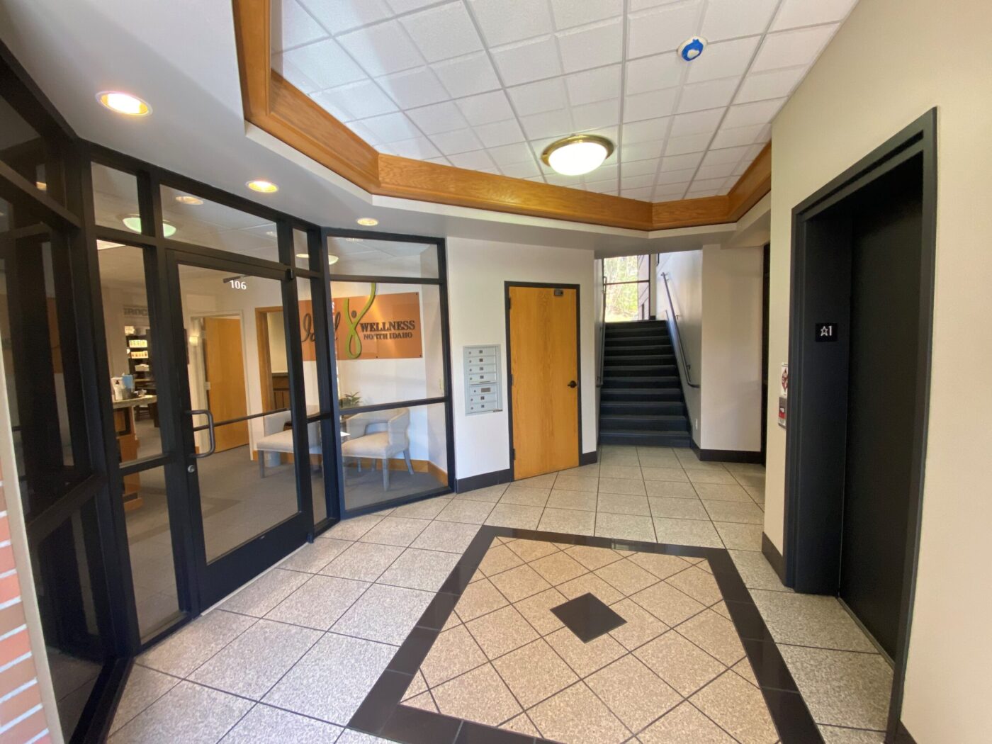 lobby, elevator, and glass office entrance